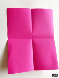 pink paper folded up on top of each other