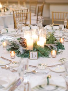 the table is set with candles and place settings