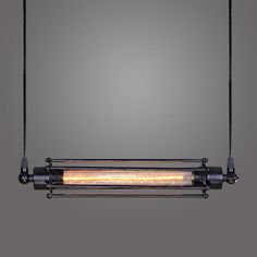 an industrial style hanging light fixture with two lights on each side and one light in the middle