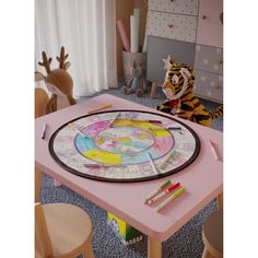 a child's play table with toys on it and a stuffed tiger in the background