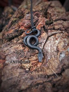 Iron snake pendant. This snake pendant is made out of iron. It's made with burnt linseed oil as coating to prevent rust and to get this beautiful black color -It's about 40mm high and 24mm width. (Can be customized) - Cord is included Please allow at least 2-5 weeks for delivery to USA, Canada and Europe, 3-5 weeks to Australia, Latin America, Asia, Africa and Oceania, and about 12-21 days to most Eastern European countries. Shipping worldwide Thank you for visiting my shop and have a great day! Iron Necklace, Serpent Necklace, Celtic Spiral, Iron Jewelry, Blacksmith Projects, Viking Pendant, Iron Pendant, Metal Working Projects, Snake Pendant