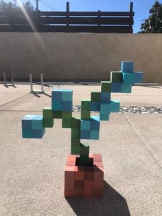 a small tree made out of blocks on the ground