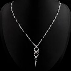 Silver-colored chain necklace with celtic chainmail and spike pendant. The pendant is 1.2 cm / 0.5 in wide and 5 cm / 2 in long. The necklace is 40 cm / 15.7 in long and has a 5 cm / 2 in extension chain. This piece is made of stainless steel, which means it won't rust or darken with time, or in contact with the skin or with water. It is an hypoallergenic material as well. All of my jewellery is handmade by me in France, and I ship internationally with a tracking number. Chainmaille Jewelry Patterns, Gothic Pendant, Chainmaille Jewelry, Spike Necklace, Chain Maille Jewelry, Chain Maille, Chain Mail, Jewellery Ideas, Jewelry Patterns