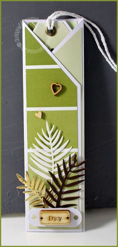 a card with some leaves on it