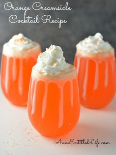 three orange cocktails with whipped cream on top and the caption for an article