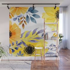 yellow and blue flowers on white wall mural in living room with wooden floor, ladder and chair