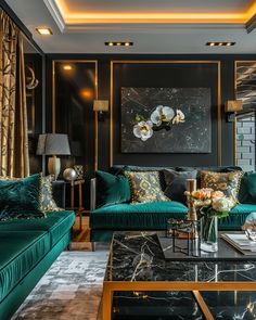 a living room filled with green couches next to a painting on the wall and coffee table