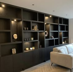 a living room filled with furniture and shelves