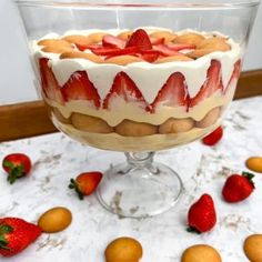 a dessert dish with strawberries and almonds around it