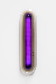 a purple object sitting on top of a white surface