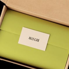 an open box with a piece of paper on it that says alilfgri