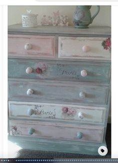 an old dresser has flowers on it