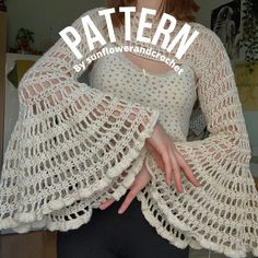 a woman wearing a white crochet shawl with the words pattern on it