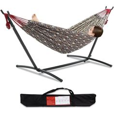 a young boy laying in a hammock