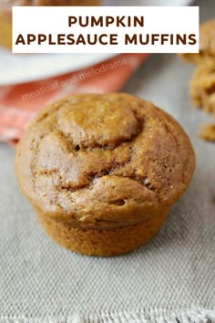 pumpkin appleauce muffins on a table with text overlay that reads, pumpkin appleauce muffins