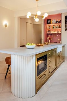 a large kitchen with an island in the middle and lots of counter space around it