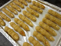 there are many pieces of food on the baking sheet ready to be baked in the oven