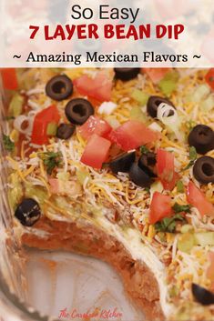 an easy mexican dip recipe with black olives, tomatoes, and cheese on top