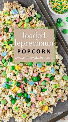 loaded leprechaun popcorn on a baking sheet with sprinkles