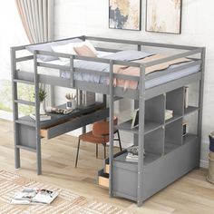 a loft bed with desk underneath it in a living room next to a wall mounted painting