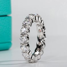 This eternity band ring is incredibly versatile and perfect for everyday wear, adding a touch of glamour to your outfit. It is also great for special occasions and can be stacked with other rings or paired with other pieces of jewelry to create a truly personalized look. Description Sterling Silver Moissanite Stones Round Stone Shape Clear Color 0.3ct (Each Stone) Weight About 3.5g GRA Certified Eternity Band Engagement Ring, Eternity Engagement Ring, Moissanite Wedding Band, Moissanite Necklace, Moissanite Earrings, Eternity Band Ring, Moissanite Jewelry, Wedding Band Ring, Moissanite Wedding Bands