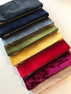 If you are stuck trying to find a perfect bridesmaid gift or fancy treating yourself, these velvet pouches are perfect! You can choose from a variety of colours and if you can't see what you are after just drop me a message and I can try to source the colour for you. These bags come with a strong zip and are lined with a matching soft polyviscose lining. Dimensions (approx) 22cm x 13cm Each bag is made by hand in my studio, so it can be customised to your specific requirements. If you could give Fancy Clutch Purse, Fancy Handbags, Velvet Makeup, Silver Clutch Bag, Bridal Clutch Bag, Black Makeup Bag, Stylish Bride, Black Clutch Bags, Japanese Knot Bag