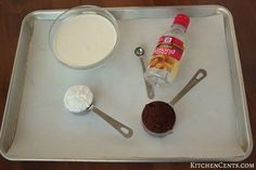 ingredients for chocolate cake sitting on a baking tray