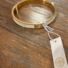 Beautiful Tory, Burch, White And Gold Bracelet Definitely A Summer Essential With Your Summer Wardrobe White And Gold Bracelet, October Jewelry, Tory Burch Bracelet, Open Cuff Bracelet, Wrist Jewelry, Tory Burch Jewelry, Jewelry Beautiful, Dope Jewelry, White Gold Bracelet