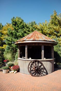 a gazebo sitting on top of a brick patio