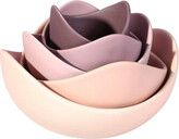 four bowls are stacked in the shape of flowers