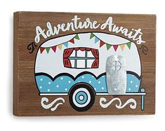 a wooden sign with an rv painted on it