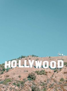 the hollywood sign is on top of a hill