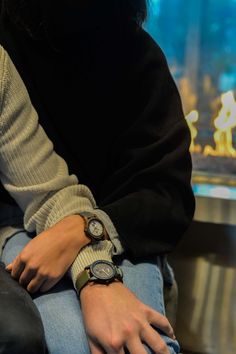 a person sitting down wearing a watch