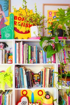 The colourful studio of Kitiya Palaskas, craft-based designer, filled with eclectic decor, indoor plants, and creative books Pastel Danish, Eclectic Maximalism, Art Studio Space, Studio Office, Dopamine Decor, Book Library, Creative Office, Quirky Home Decor, Space Decor