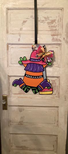 the door is decorated with an image of a scarecrow on it's hat