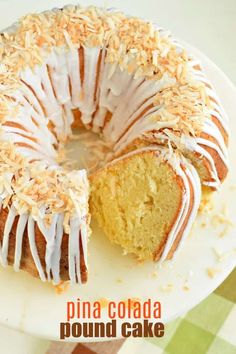 a bundt cake with white icing and coconut sprinkles on top