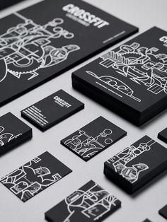 black and white business cards with designs on them