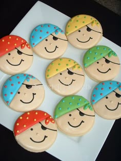 six decorated cookies with faces on them