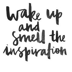 the words wake up and smell the inspirational phrase in black ink on a white background