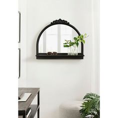 Add charming style and function to your wall with this Black Ornate Arch Wall Mirror with Shelf. Its convenient shelf provides space for decor and accessories! Overall dimensions Width: 23.5 in. Depth: 4.5 in. Height: 19.75 in. Crafted of wood and mirror Black finish Arched shape Features a shelf Ornate crown and beaded detailing Weight: 9.24 lbs. Hangs from back-mounted hardware Care: Dust with a soft, dry cloth. To clean mirror, spray a small amount of glass cleaner onto a lint-free cloth and wipe clean. This item is available at Kirklands.com only, not available in stores. Please note: this item cannot be shipped to APO/FPO addresses. WARNING: Cancer and Reproductive Harm - For more information go to www.P65Warnings.ca.gov . | Ornate Arch Wall Mirror with Shelf, Black, Small, Wood | Kir Bedroom Dresser Mirror, Arch Wall Mirror, Arched Wall Mirror, Arched Wall, Wall Mirror With Shelf, Arch Wall, Shelf Black, Living Vintage, How To Clean Mirrors