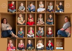 a group of children and adults sitting in a cardboard box with stuffed animals on them