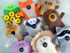 there are many different animal hair clips in the shape of animals with buttons on them