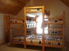 the bunk beds are made up and ready to be slept - in or put on