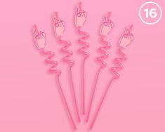 six pink plastic sticks with fingers sticking out of them on a pink background and the number 16 in the middle