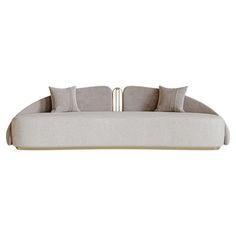 a white couch with pillows on it and a metal bar in the middle of it