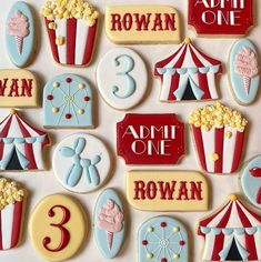 decorated cookies with numbers and circus theme for an adult one - to - two birthday party