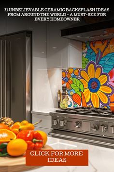 a kitchen with stainless steel appliances and colorful artwork on the backsplash above it