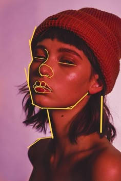 a woman with yellow lines on her face