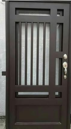 an image of a wooden door with bars on it