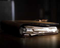 a wallet sitting on top of a wooden table